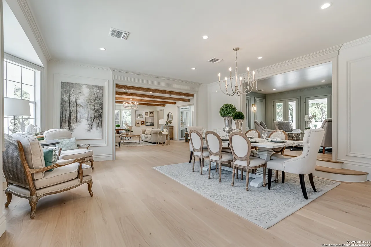 Formal dining room remodel with open concept layout, European white oak floors, and crown molding in Castle Hills San Antonio TX