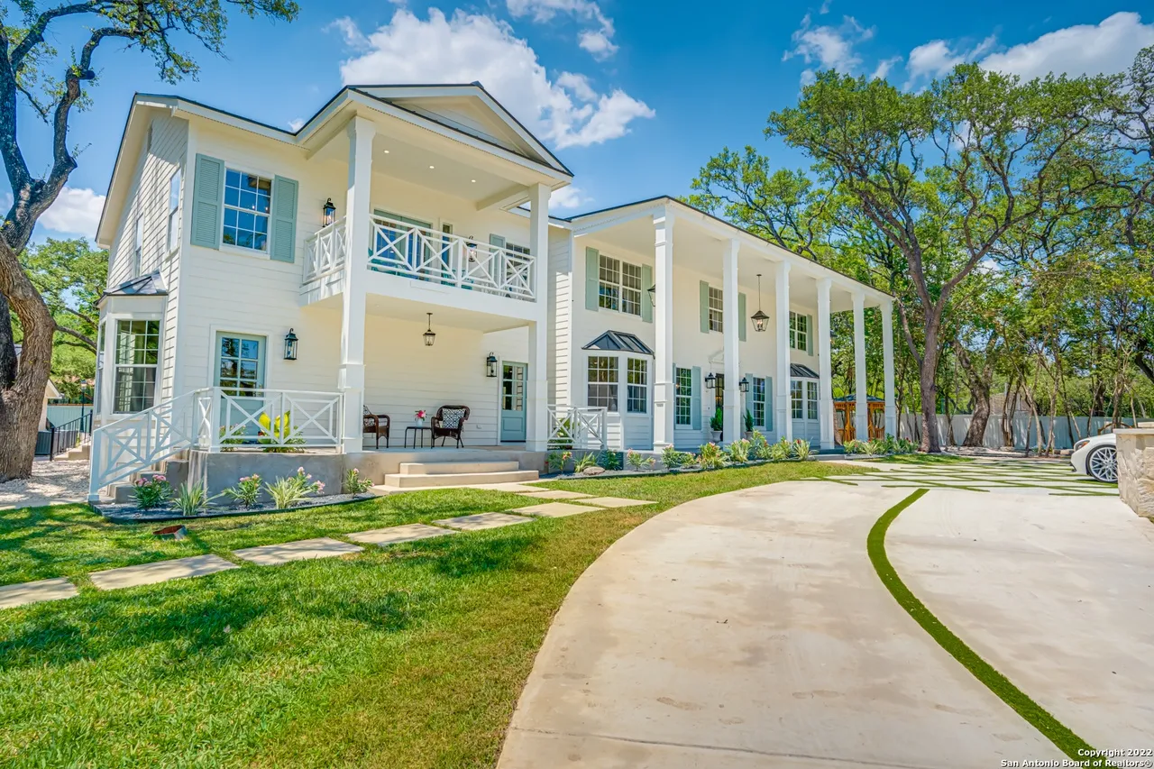 Southern Colonial estate exterior remodel with wraparound porch and second-floor balcony in Castle Hills San Antonio TX