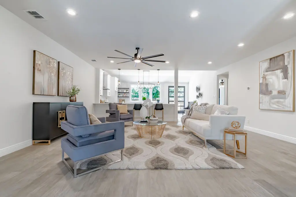 Open concept living room renovation with modern finishes and recessed lighting in San Antonio