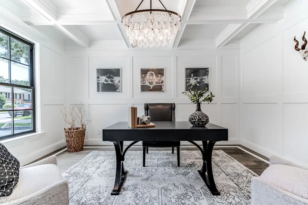 Custom home office with coffered ceiling and elegant chandelier in San Antonio TX