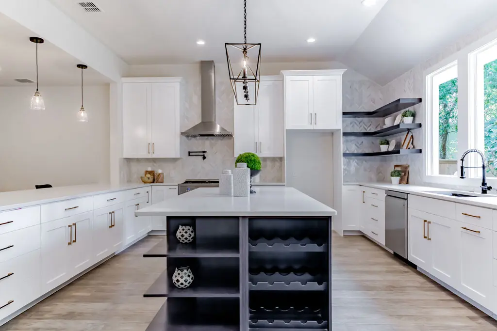 Spacious kitchen remodel with custom island wine storage and floating shelves in San Antonio